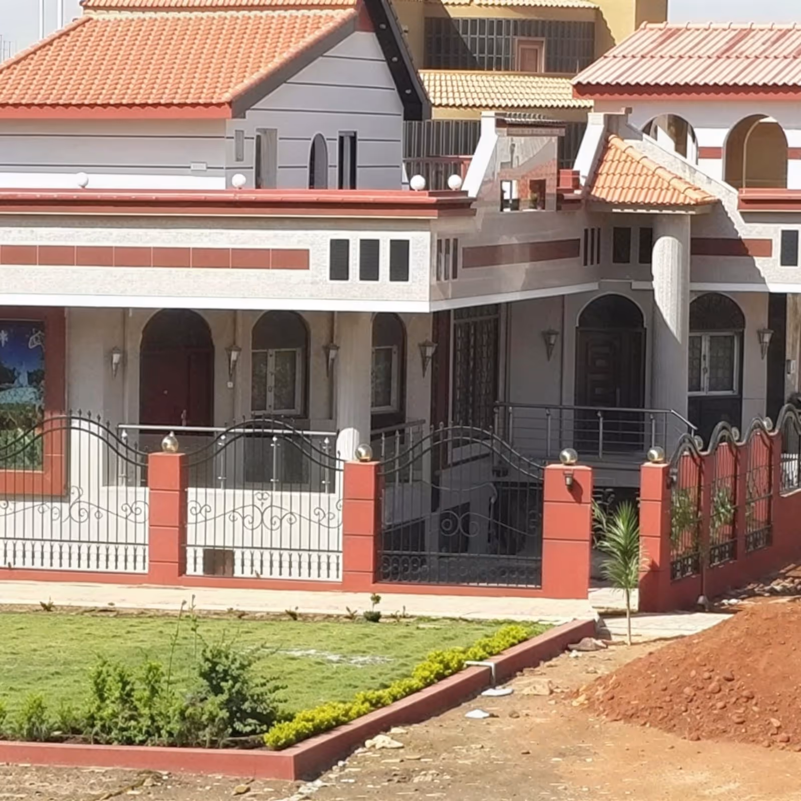 Front elevation of the completed private villa showing the main facade and landscaped approach.